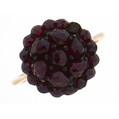 Appraisal: A garnet cluster ring c gold coloured metal hoop g