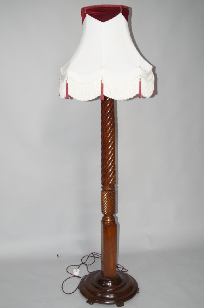 Appraisal: A mahogany bed post floor lamp with spiral turned column