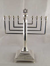 Appraisal: Judaica A silver chanukia on a square base with squared