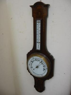 Appraisal: AN EDWARDIAN ANEROID BAROMETER with thermometer ceramic dial in inlaid