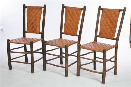 Appraisal: THREE HICKORY-STYLE SIDE CHAIRS Rustic chairs with rush seats h