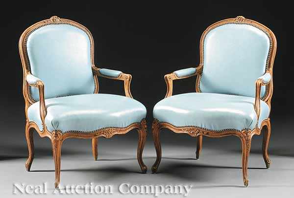 Appraisal: A Pair of Louis XV Carved Walnut Fauteuils late th