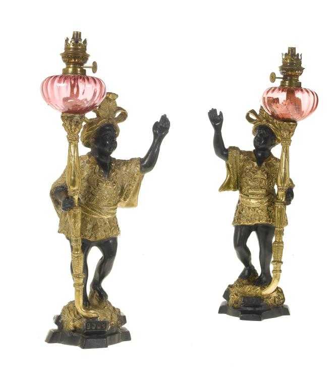 Appraisal: A PAIR OF BLACK AND GILT PATINATED METAL BLACKAMOOR OIL