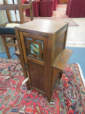 Appraisal: Oak Arts Crafts Cabinet slag glass in door interior shelf