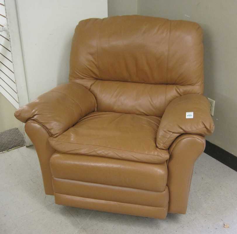 Appraisal: A CONTEMPORARY LEATHER RECLINER ROCKER Prestige Leather Furniture Co adobe