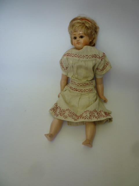 Appraisal: An early composition Miss Peck shoulder head doll with brown