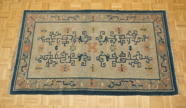 Appraisal: Chinese Rug Dominantly tan field with blue borders and block