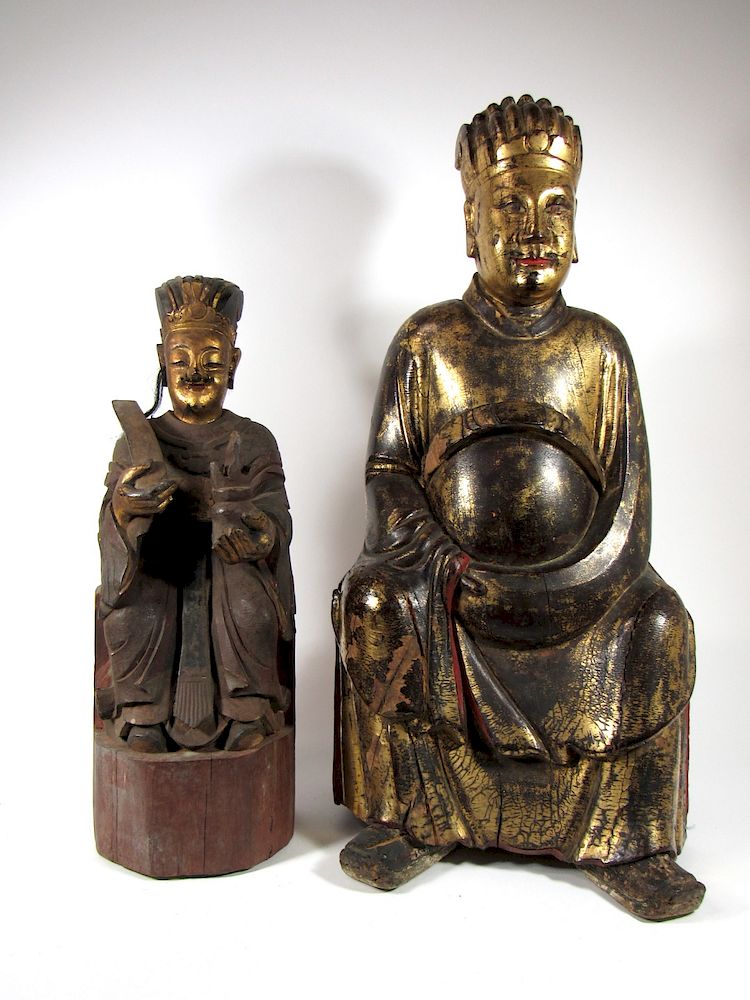 Appraisal: Two Lacquered Giltwood Carvings of Ancestors Chinese lacquer and gold