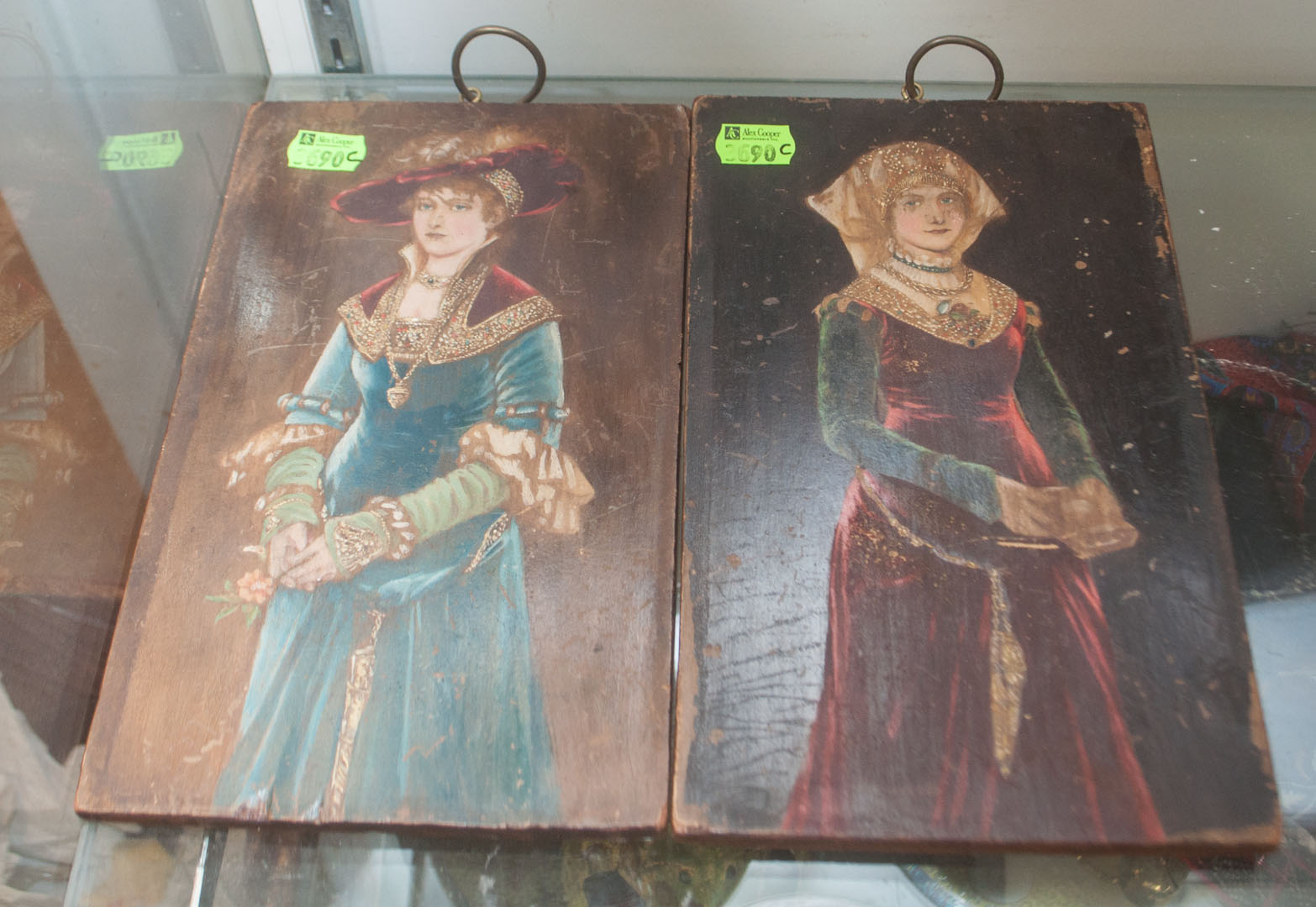 Appraisal: c Two painted wood plaques