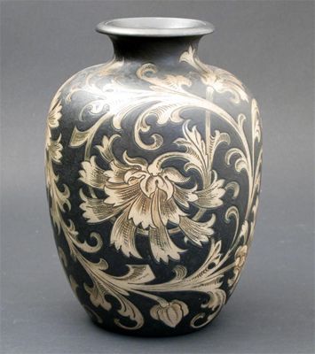 Appraisal: A Martin Brothers stoneware vase incised with scrolling foliage painted