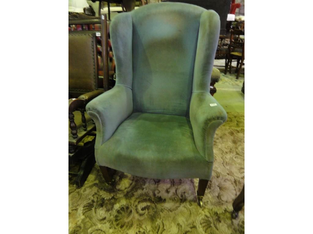 Appraisal: An Edwardian wing back armchair with powder blue upholstery raised