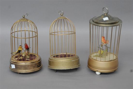 Appraisal: GROUP THREE AUTOMATON BIRD CAGES One lacking birds as is