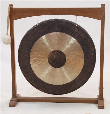 Appraisal: An Arts Crafts style oak framed dinner gong By the