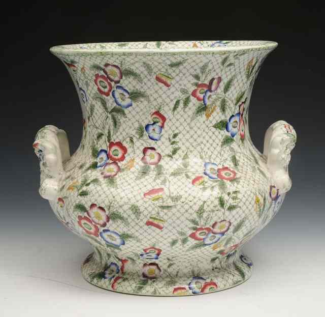 Appraisal: A VICTORIAN POTTERY JARDINIERE with moulded handles and flower decoration