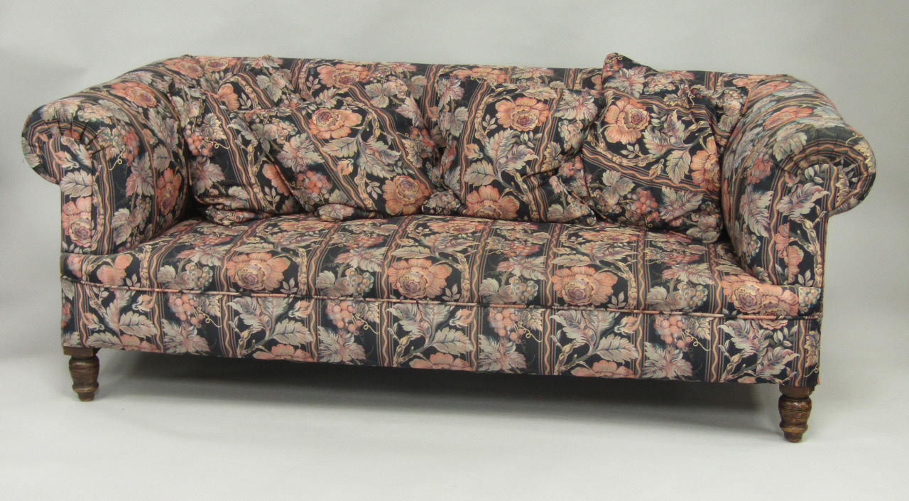 Appraisal: A Victorian Chesterfield two seater sofa upholstered in striped floral