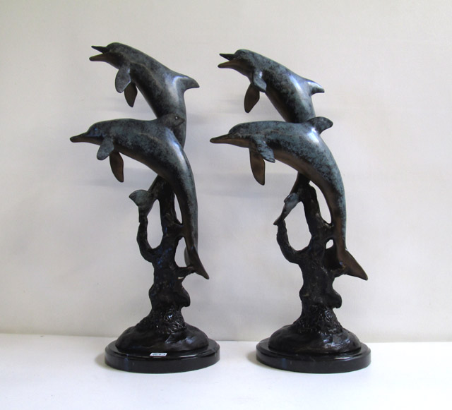 Appraisal: PAIR POLYCHROME MARINE WILDLIFE BRONZES marbleized polychrome enamel dolphin groups