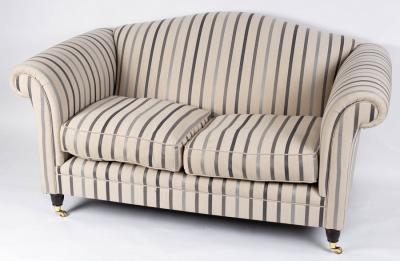 Appraisal: A Laura Ashley two-seater sofa upholstered in a striped fabric