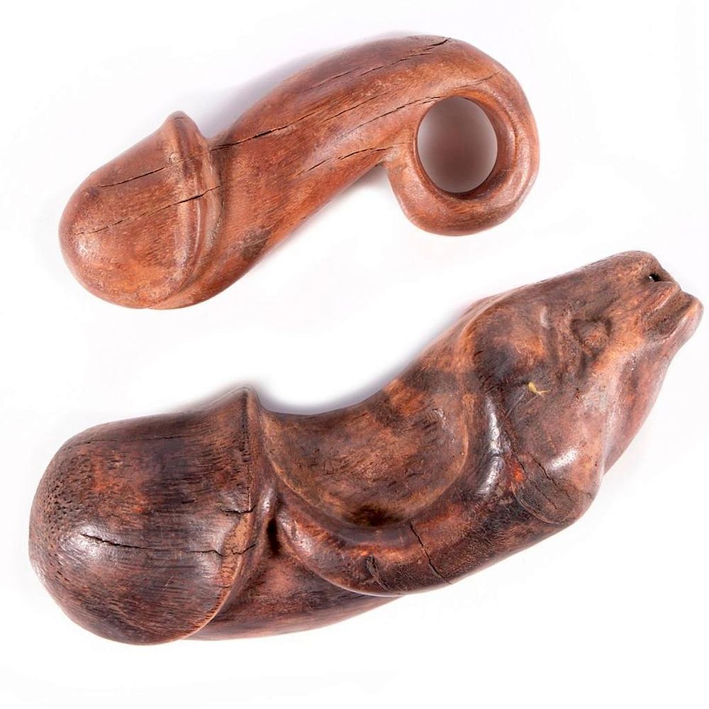 Appraisal: Two carved wooden phalluses Two carved wooden phalluses measuring and