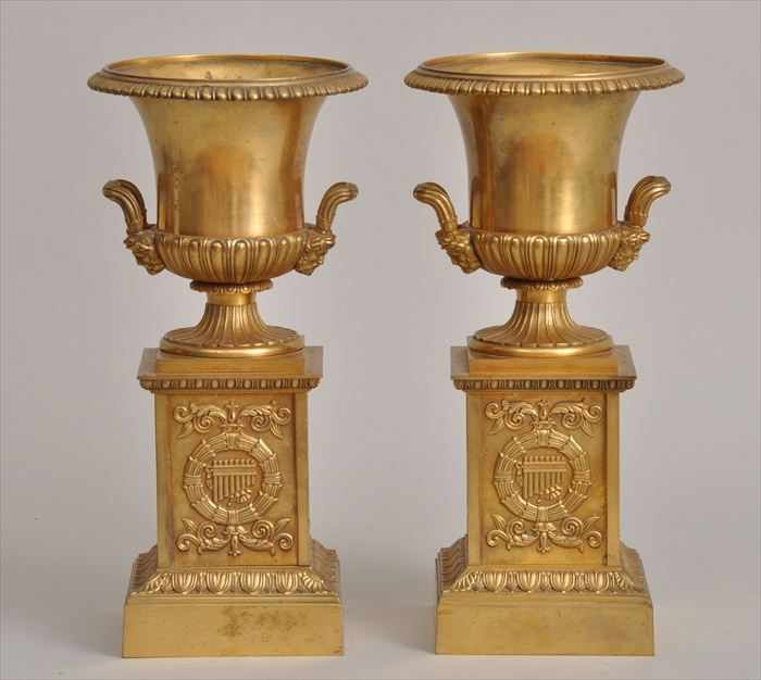 Appraisal: PAIR OF CHARLES X-STYLE GILT-METAL URNS Each bowl with everted