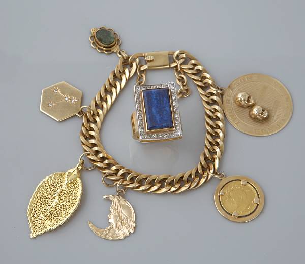 Appraisal: An k gold charm bracelet with six gilt and gold