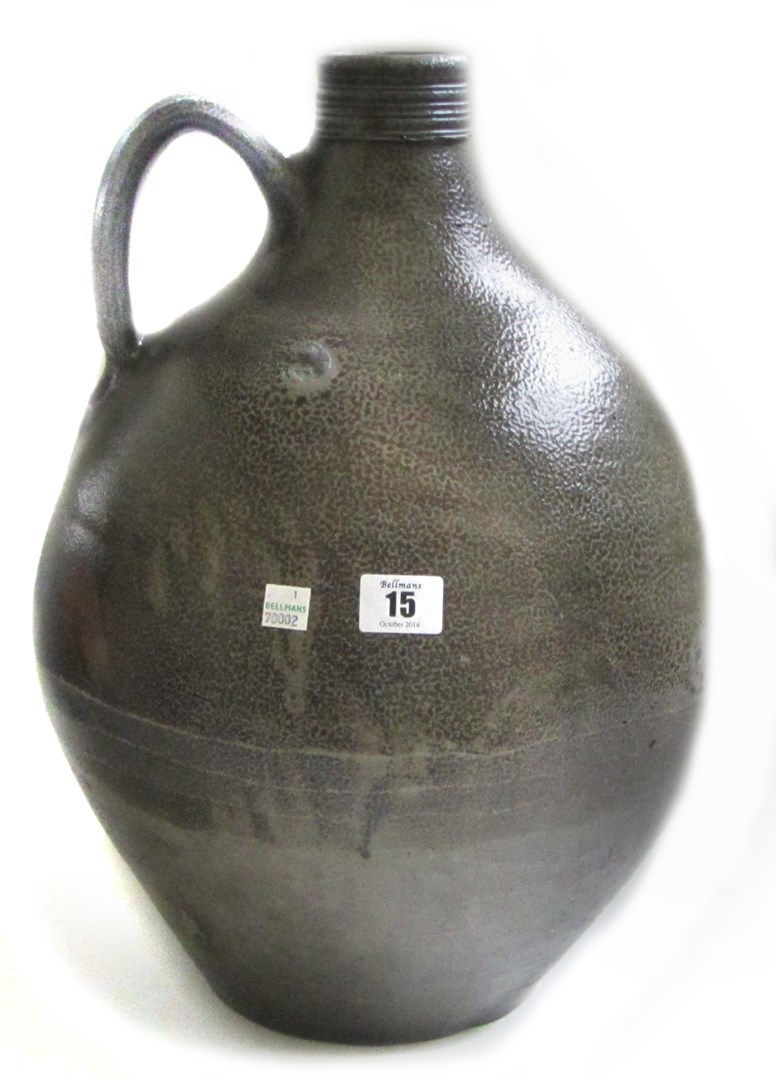 Appraisal: A large stoneware bellarmine with loop handle and reeded rim