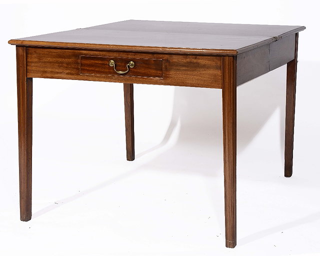 Appraisal: A th Century mahogany foldover tea tablefitted one drawer on