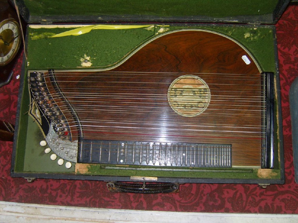 Appraisal: An early th century cased zither with label to interior