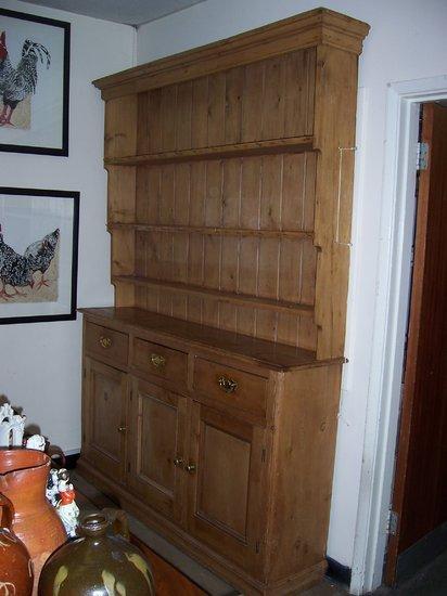 Appraisal: A pine dresser the shelves over with moulded cornice the