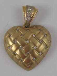 Appraisal: A hallmarked carat gold diamond set heart pendant approx cm