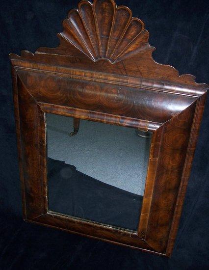 Appraisal: An th Century oyster veneered cushion framed mirror with associated