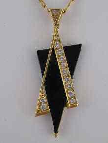 Appraisal: A yellow metal tests carat gold diamond and onyx Magen