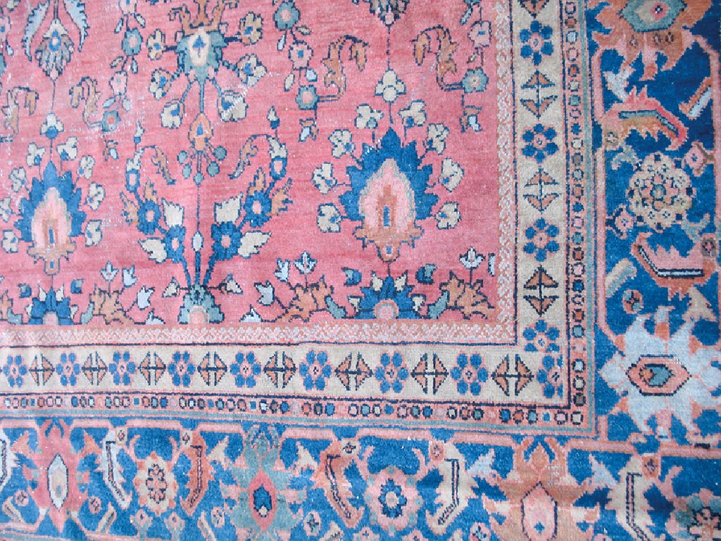 Appraisal: AN AGRA TYPE SMALL CARPET the salmon pink ground worked