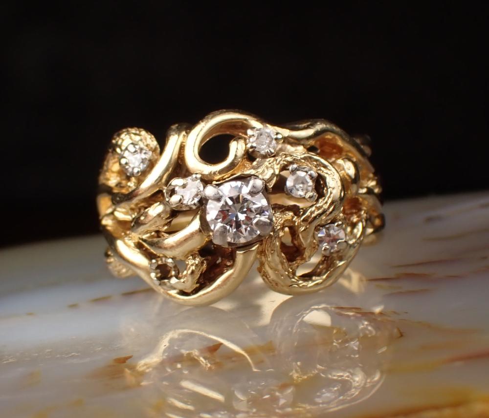 Appraisal: DIAMOND AND FOURTEEN KARAT GOLD FREEFORM RING with five round