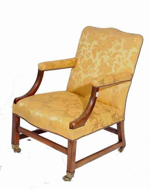 Appraisal: A GEORGE III GAINSBOROUGH STYLE MAHOGANY LIBRARY ARMCHAIR with fluted