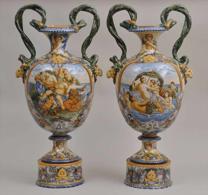 Appraisal: PAIR OF RENAISSANCE-STYLE MAJOLICA TWO-HANDLED VASES ON STANDS Each ovoid