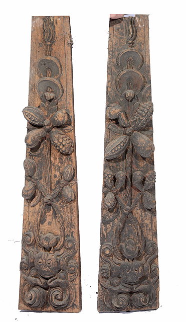 Appraisal: A pair of carved wood pilastersof slightly tapering form the