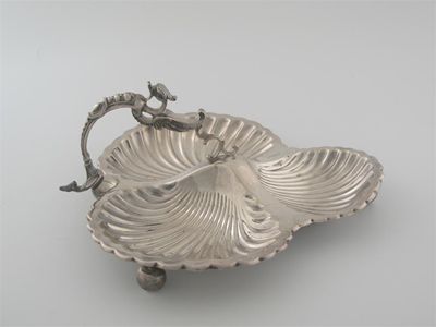 Appraisal: An Edwardian trefoil-shaped hor d'oeuvre's dish with shell bowls and