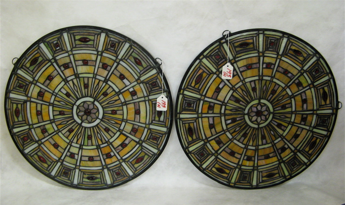 Appraisal: PAIR ROUND STAINED AND LEADED GLASS WINDOW PANELS having radial