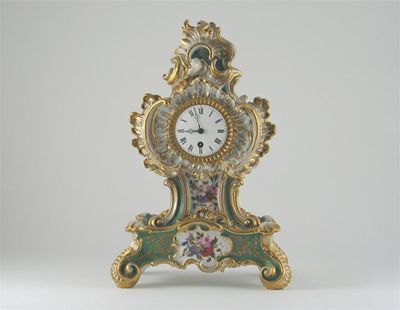 Appraisal: A Jacob Petit mantel clock and stand moulded with elaborate