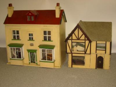 Appraisal: A painted wood dolls house scratch built with pitched roof