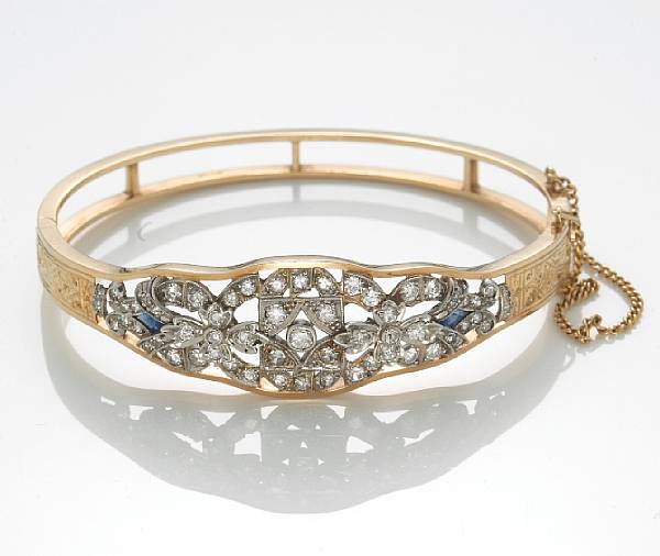 Appraisal: A diamond sapphire and k bicolor gold bangle bracelet diameter