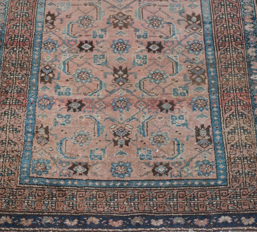 Appraisal: HAMADAN RUNNER with light pink central field within blue and