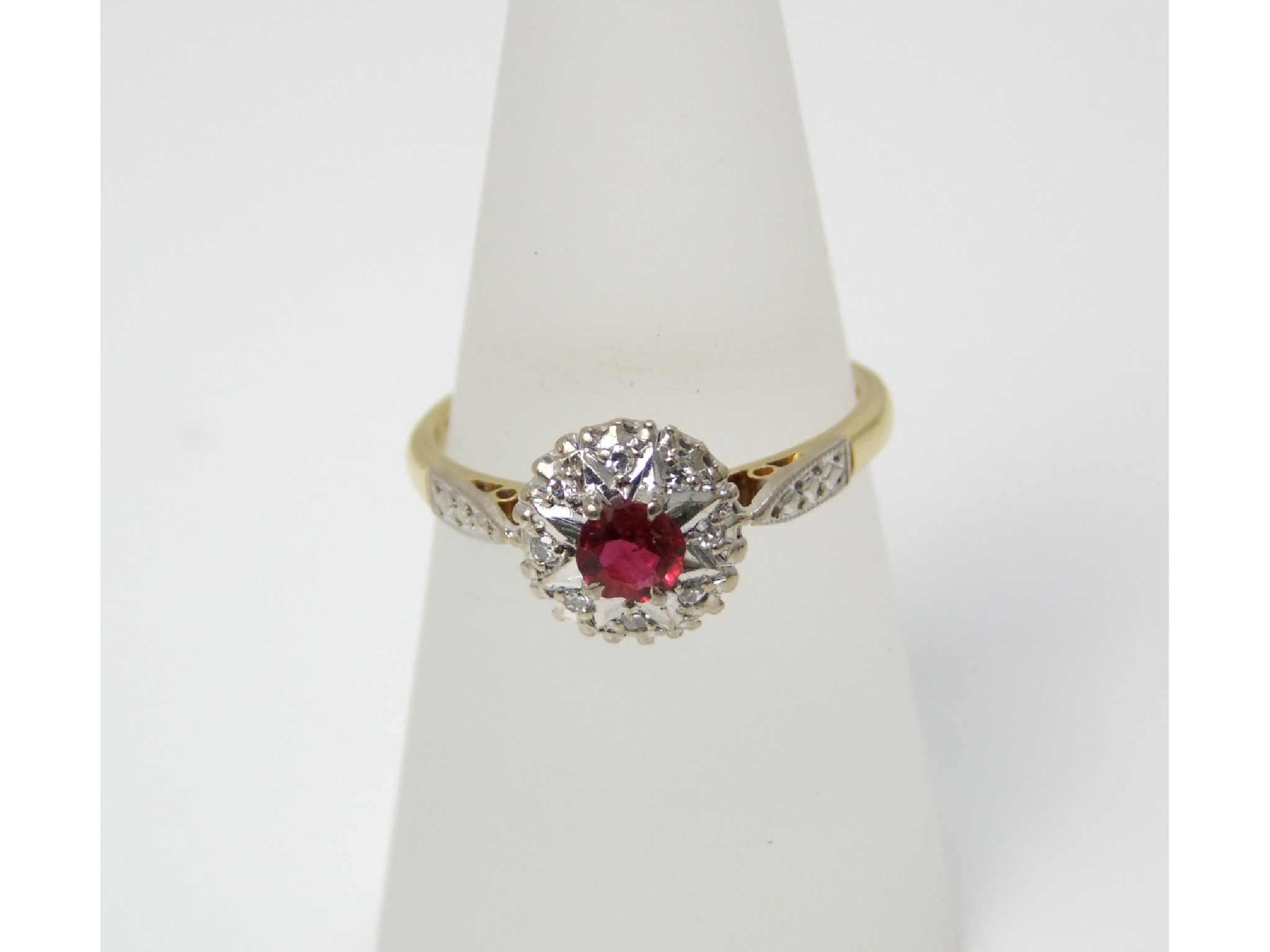 Appraisal: An ct gold cluster ring the ruby surrounded by eight