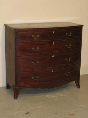 Appraisal: A MAHOGANY CHEST OF DRAWERS of bowed form with stringing