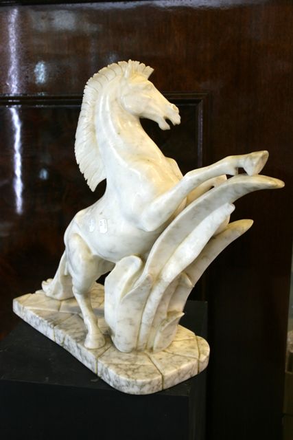 Appraisal: An alabaster sculpture depicting a horse cm high