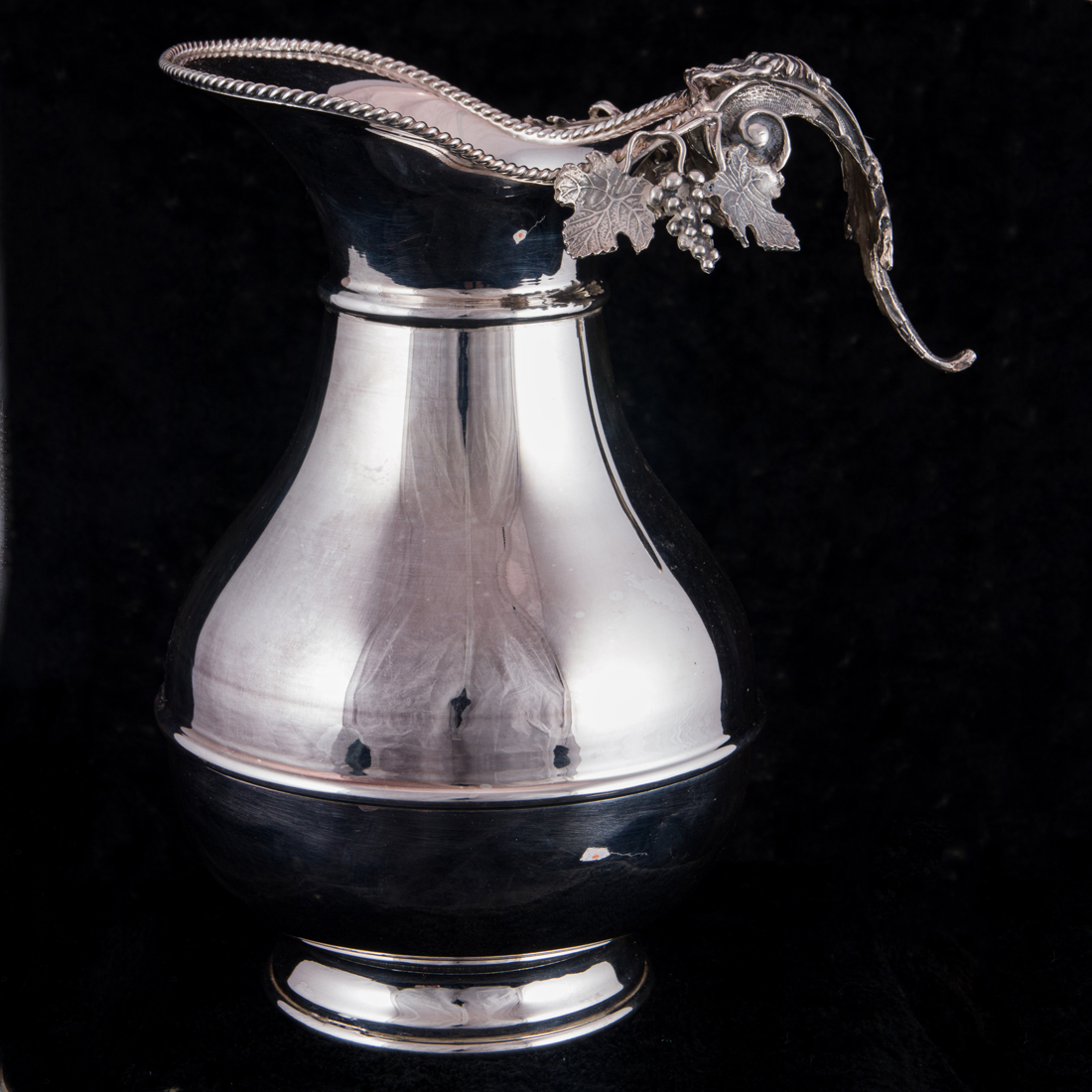 Appraisal: A MODERN ITALIAN SILVER CLARET JUG A Modernist Italian silver