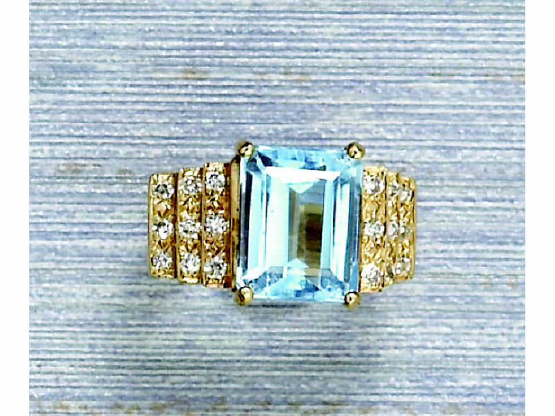 Appraisal: BLUE TOPAZ AND DIAMOND RING k yellow gold lady's ring