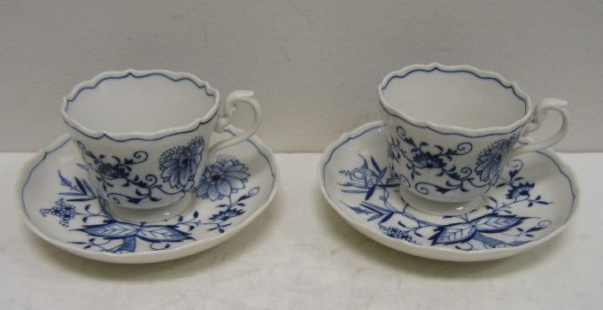 Appraisal: TWO MEISSEN BLUE ONION CUP SAUCER UNITS Early th century