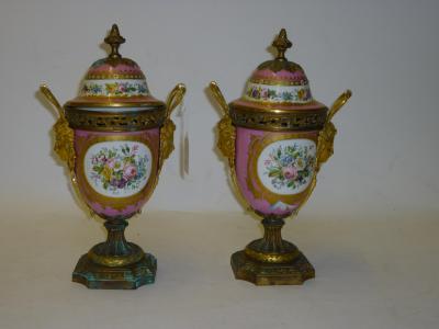 Appraisal: A PAIR OF CONTINENTAL PORCELAIN GARNITURE VASES of ovoid form