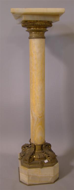 Appraisal: CLASSICAL ORMOLU MOUNTED YELLOW ONYX PEDESTAL having a bronze collar